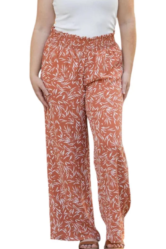 Embroidered women trousers with intricate details for a unique charmPrinted Palazzo Pants In Rust